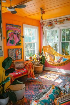 an orange room with hammock and potted plants