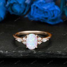 Presenting a breathtaking piece of elegance, this Natural Opal Ring is a true celebration of beauty and sophistication. Crafted in lustrous 14k solid gold, it embodies the essence of timeless grace. The centerpiece is a stunning oval-shaped natural opal, capturing the iridescence and mystique that makes opals so enchanting. As the birthstone for October, this opal ring becomes not just a piece of jewelry but a symbol of personal connection and significance. Its ethereal play of colors within the Heirloom Oval Opal Ring For Anniversary, Oval Opal Ring For Anniversary, Oval Opal Halo Ring In 14k Gold, Opal Birthstone Ring Oval Cabochon For Anniversary, Opal Birthstone Ring With Oval Cabochon For Anniversary, Oval Cabochon Opal Birthstone Ring For Anniversary, Oval Cabochon Opal Ring For Anniversary, Oval Cabochon Opal Ring With Accent Stones For Anniversary, Oval Cluster Ring As Gift