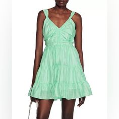 - Short Ruffled Dress Sandro Women - Wide Straps To Tie In The Back - V Neckline - Flared Skirt With Flounce - Fitted At The Waist - Openwork And Elasticated At The Back Summer Cocktail Mini Dress With Tiered Skirt, Sleeveless Sundress With Ruffle Hem For Date Night, Summer Dress With Pleated Tiered Skirt, Green Tiered Skirt Mini Dress For Summer, Green Tiered Mini Dress For Spring, Chic Green Tiered Mini Dress, Green Ruched Sleeveless Sundress, Chic Green Ruched Sundress, Short Ruffled Dress