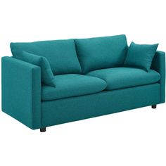 a teal colored couch with pillows on it's arms and backrests