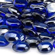 blue glass beads are stacked on top of each other