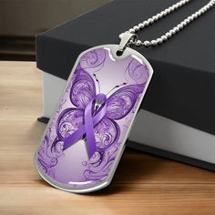 Our premium Purple Ribbon monogrammed jewelry is crafted with high-quality surgical steel and offers an additional option of an 18k gold finish for most necklaces. This expertly-made piece is a meaningful keepsake for yourself or a loved one. We Offer a 100% Happiness Guarantee. Product Specifications: Round Pendants: 0.9" x 0.9" (23.5mm x 23.5mm), with an 18-22" chain. Heart Pendants (printed): 24mm x 24mm), with an 18-22" chain. Heart Pendants (engraved): 0.9" x 0.94" (2.3cm x 2.4cm), with an Military Necklace, Butterfly Ribbon, Chain Heart, Heart Pendants, Ribbon Necklace, Monogram Jewelry, Purple Ribbon, Working Mother, Dog Tag