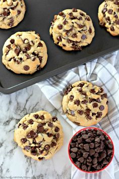 chocolate chip cookies in a muffin tin with a bowl of chocolate chips next to it