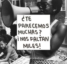 a black and white photo of a woman holding a megaphone