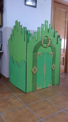 a cardboard castle made to look like it has the letter o on it and is sitting in front of a door