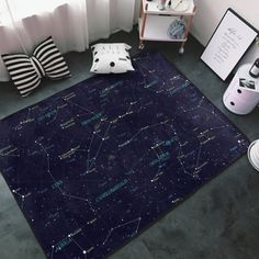 a large rug with stars on it in the middle of a room next to a window