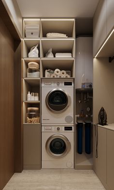 a washer and dryer in a small room with shelves on the wall behind them