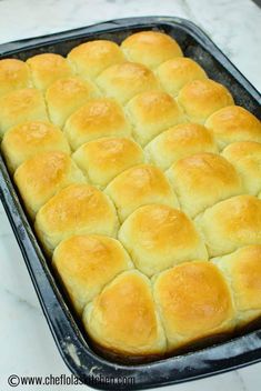 a pan filled with bread sitting on top of a counter