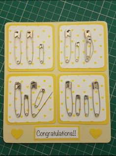 there are four pairs of scissors in the box with congratulations written on each one side