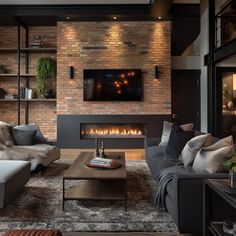 a living room with two couches and a fire place in the middle of it