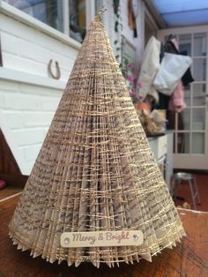 a close up of a small christmas tree on a table