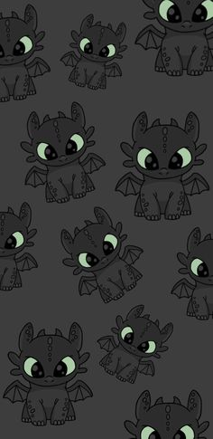 a bunch of little cartoon monsters with green eyes