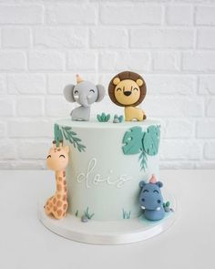 there is a cake with animals on it