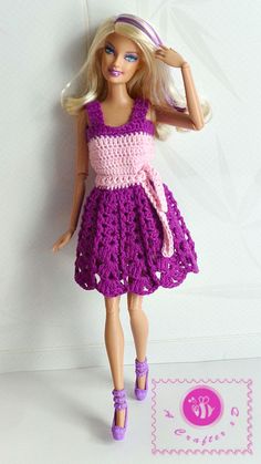 a barbie doll wearing a purple dress and pink shoes with her hair in the air