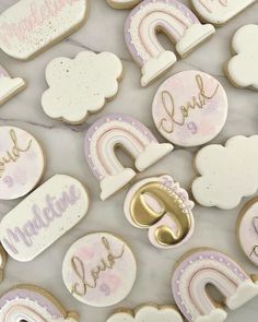 decorated cookies with pink and white icing on a table