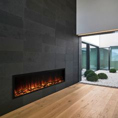 a modern fireplace in the middle of a room