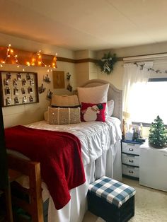 a bedroom with christmas lights on the ceiling