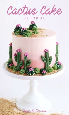 a cake with pink frosting and green cactus decorations