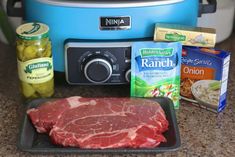 some food is sitting on a counter next to an air fryer and other items