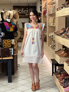 This Adorable Babydoll Dress is the perfect addition to your wardrobe. It's made out of fresh cotton or manta (as its called in Spanish) and it is hand embroidered with cotton string. The design is unique with lace details throughout and the colorful embroidery reflects the Rich Mexican culture! Note: Shoes and Jewelry modeled may be purchased here: Shoes: https://www.etsy.com/es/listing/828873953/zapato-artesanal-de-plataforma-zapato?ref=listings_manager_grid Filigrana Earrings: https://www.ets Beach Cotton Dress With Multicolor Embroidery, Folk Style Cotton Dress For Vacation, Beach Dress With Multicolor Embroidery In Cotton, Folk Style Cotton Dress With Embroidered Hem, Beach Dress With Multicolor Embroidery, Multicolor Embroidered Cotton Beach Dress, Beach Embroidered Cotton Dress With Multicolor Embroidery, Multicolor Embroidered Cotton Dress For Beach, Multicolor Cotton Embroidered Dress With Embroidered Hem