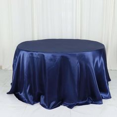 a round table covered in blue satin