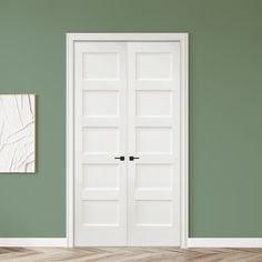 an empty room with green walls and two white doors in the center, there is a piece of paper hanging on the wall