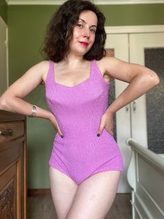 Vintage 60s pink ribbed one-piece swim suit.  Made in Germany  by "Une creation DARINA". SIZE. Size small to medium.  length 60 cm / 23.6" bust 80 cm / 31.4" waist 60 cm / 23" hips 84 cm / 33" fabric stretches. For reference:  Model is:  bust 88 cm | 34" waist 70 cm | 31" hips 94 cm | 37" hight 1.55 m or 5.1 feet B cup breast.  Made from ribbed and a bit fluffy polyamide fabric, that reminds a little bit terrycloth fabric.  Built-in plastic mesh conical shaped bra.  CONDITION. Very good conditio Pink Stretch Ribbed Bodysuit, Pink Fitted Sleeveless One Piece, Fitted Ribbed Sleeveless Swimwear, Pink Ribbed Summer Bodysuit, Pink Ribbed Bodysuit For Summer, Pink Fitted One-piece Leotard, Fitted Pink One-piece Leotard, Plastic Mesh, Pink Ribbed