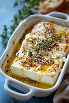 some food in a white dish on a blue table