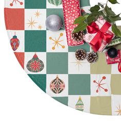 christmas presents and decorations on a checkered table cloth