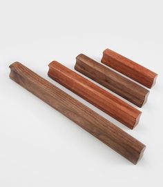 three pieces of wood sitting next to each other