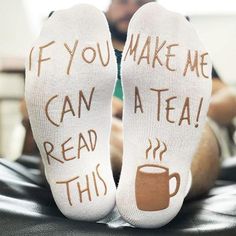 two feet with socks that say if you make me can a tea, read this