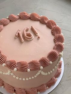 a pink cake with the number forty on it