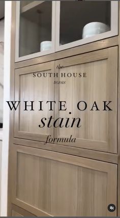 the white oak stain has been painted in an antique style with black lettering on it