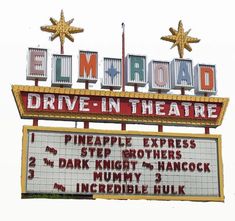 the sign for elm road drive - in theatre is lit up and has stars on it