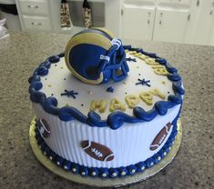 a football themed birthday cake on a kitchen counter