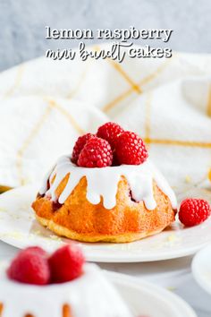 a lemon raspberry mini bundt cake on a plate with raspberries