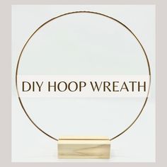 a round metal object with the words diy hoop wreath on it's side