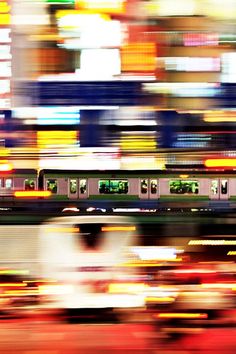 a blurry photo of a train passing by in the background is an abstract image