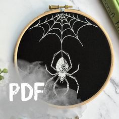 a spider is on the web in front of a black background with text that reads, freehand embroidery pattern