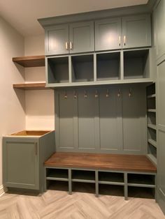 an empty room with some shelves and cabinets on the wall next to each other in it