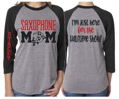 two women wearing matching shirts that say saxophone mom and i'm just here for the halloween show