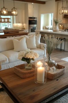 a living room filled with furniture and candles