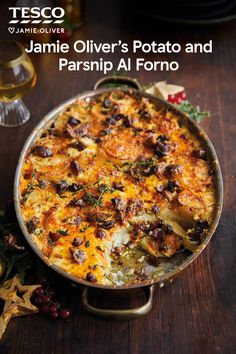 a casserole dish on a wooden table with the title jamie oliver's potato and parsnip al formo