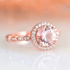 Formal Pink Round Cut Halo Ring, Pink Round Cut Halo Ring For Formal Occasions, Formal Pink Halo Ring With Round Cut, Vintage Rose Gold Round Cut Diamond Ring, Classic Pink Halo Ring, Vintage Rose Gold Diamond Ring With Prong Setting, Elegant Pink Diamond Anniversary Ring, Elegant Pink Diamond Ring For Anniversary, Pink Round Halo Wedding Ring