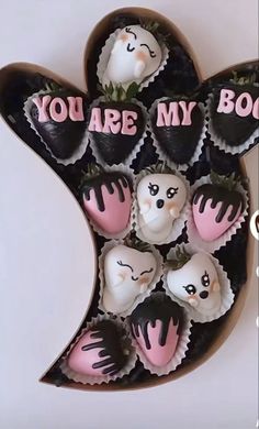 there are many chocolates in the shape of a heart with you are my boo on them