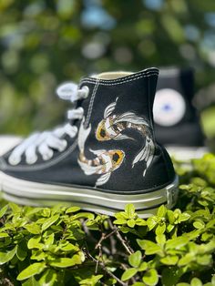 These Black Converse shoes have a birdseye view of a peaceful and relaxing koi pond! These koi fish can be seen swimming across the top of each shoe under the gentle and calm water ripples of the pond. We buy each pair of shoes BRAND NEW. Each pair is made to order, please make sure you put in the correct shoe size before you check out. The ink is permanent and will never come off, fade away, or peel off. Made in the USA. This price includes everything: shoes and artwork. Because the artwork is Fish Shoes, Converse Shoes Men, Custom Converse Shoes, Birdseye View, Dragon Chino, Custom Converse, Black Converse, Water Ripples, Shoe Inspo