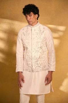 Pink bundi with all-over cutwork floral patterns and stone embellishments. Comes with kurta and pant. - Aza Fashions Straight Kurta Nehru Jacket With Intricate Embroidery For Reception, Nehru Jacket With Intricate Embroidery For Reception, Chanderi Nehru Jacket With Chikankari Embroidery, Nehru Jacket With Chikankari Embroidery For Diwali Reception, Straight Kurta Nehru Jacket For Wedding And Navratri, Wedding Nehru Jacket For Navratri In Straight Kurta Style, Nehru Jacket For Wedding And Navratri, Transitional Festive Nehru Jacket With Cutdana, Transitional Chanderi Nehru Jacket For Reception