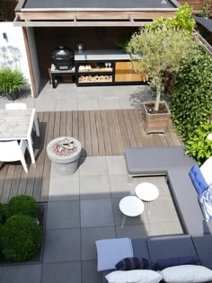 an aerial view of a patio with tables and chairs