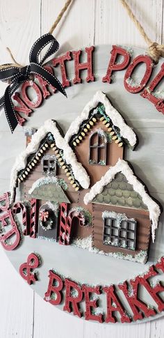 a christmas ornament hanging on a wall with the words north pole and break