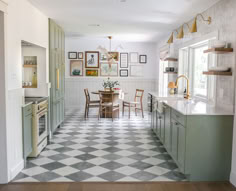 the kitchen is clean and ready to be used for dinner or lunch time, as well as family photos on the wall